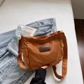 Minimalist caramel canvas crossbody bag with vintage leather patch and adjustable strap - Brown