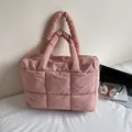 Quilted puffer tote bag in soft pink finish with padded handles for casual daily use - Pink