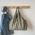 Army green nylon pleated tote bag with drawstring side pockets and large capacity - Green
