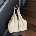 Minimalist beige pleated nylon tote bag with large capacity and shoulder straps - Off-white