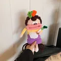 Handmade crochet sausage lip doll crossbody bag in pink and yellow yarn with carrot decor - Rabbit Ear Design