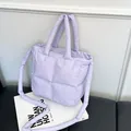 Light purple quilted puffer tote bag with dual handles and long shoulder strap - Purple