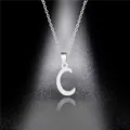 Macro shot of polished stainless steel letter C pendant with silver mirror finish - Letter C