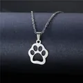 Polished stainless steel necklace featuring a hollow cat paw pendant on a display stand - Pet Paw Print Hollow Style (XL36)