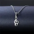 Polished stainless steel treble clef musical note pendant necklace on a grey display stand - Music Treble Clef Style (XL61)