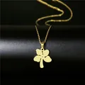 Minimalist gold stainless steel four leaf clover necklace on a black textured background - Clover Flower Style (115)
