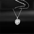 Elegant stainless steel monstera leaf pendant necklace on a premium black jewelry stand - Monstera Leaf Style (XL109) / Silver