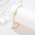 Detailed close-up of golden anchor bracelet with heart charm and lobster clasp closure - Anchor Style (SLJ69)