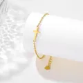 Detail of gold cross bracelet with adjustable clasp on a white textured stand - Cross Style (SLJ66)
