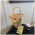 Detail of woven straw bag featuring crochet tulips and a luxury pearl chain strap - Colored Tulip