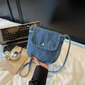 Vintage blue denim crossbody messenger bag with silver buckle and white stitching detail - Light Blue