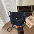 Dark blue denim crossbody bag with contrast white stitching and silver metal buckle - Black