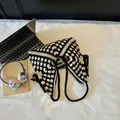 Handmade crochet tote bag with black and white diamond patterns and long fringe tassel - Black