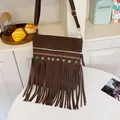 Dark brown faux suede crossbody bag with ethnic embroidery and bohemian tassels - Brown