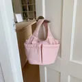 Rosafarbene wattierte Stoff-Tragetasche mit doppelten Vordertaschen und weichem Design - Gesteppter Stil mit mehreren Taschen / Rosa