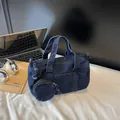 Dark blue denim cylinder bucket bag with a detachable round coin purse charm - Dark Blue