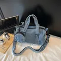 Washed blue denim bucket bag with adjustable strap and matching round coin purse - Light Blue