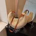 Beige woven straw hobo bag with adjustable dark brown leather strap and half-moon shape - Off White