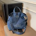 Sac fourre-tout en jean bleu pour femme avec broderie blanche et bandoulière large - Bleu foncé