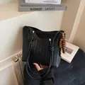 Retro black woven bucket bag with beaded charm and knotted strap details - With Pendant / Black