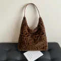 Plush faux fur leopard print tote bag with brown leather strap for autumn fashion - Brown