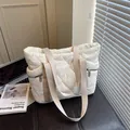 Quilted white puffer tote bag with beige straps and side zip pockets for daily commute - Off White