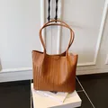 Fashionable large brown woven tote bag with dual shoulder straps for daily commute - Brown