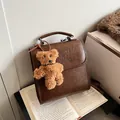 Vintage brown PU leather backpack with letter embossing and cute bear pendant charm - With Pendant / Brown