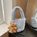 Blue faux shearling tote bag with decorative bear pendant and Clear K logo label - With Pendant / Blue