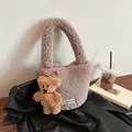 Chic brown faux shearling bucket bag with cute bear charm and woven logo tag - Gray
