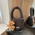 Dark brown faux shearling bucket bag with cute bear pendant and Clear K label - Brown
