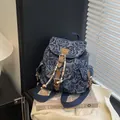 Mini vintage blue denim backpack with rose jacquard pattern and leather buckle straps - Blue