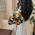 Handcrafted crochet tote bag featuring 3D white, orange and yellow floral motifs - Orange