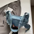 Light blue washed denim shoulder bag with wide strap and matching round coin purse - Light Blue
