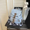 Light blue floral denim mini backpack with rose patterns and brown leather straps - Light Blue