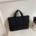 Black quilted puffer laptop bag for women featuring a stylish padded commuter design - Black