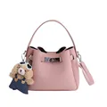 Pink bucket bag in lychee pattern leather with a cute puppy charm and shoulder strap - Pink With Pendant
