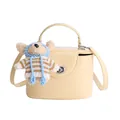 Pale yellow square crossbody bag with top handle and cute plush bear charm decoration - Yellow
