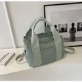Mint green canvas tote bag with multi-pocket design and adjustable shoulder strap - Fog Blue