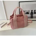 Pink canvas crossbody bag for women with wide top handles and adjustable shoulder strap - Pink