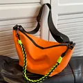 Vibrant orange nylon crescent crossbody bag with adjustable wide black strap - Orange