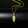 Macro detail of a 18K gold-plated stainless steel fishbone pendant on a fine link chain - Minimalist Fishbone Style (93)