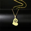Macro detail of gold-plated stainless steel heart pendant with spiral hollow pattern - Spiral Hollow Heart Style (107)