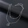 Double-layered silver necklace with wave pendant and metallic beads on a black background - Wave Circle Pendant (SC6 Beaded)