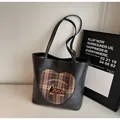 Detail view of vintage black tote bag featuring heart pattern and cartoon dog embroidery - Without Pendant / Black