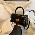 Glossy black vintage oil wax leather handbag with golden buckle and sleek top handle - Black without Pendant