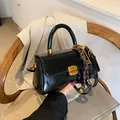 Vintage black oil wax leather handbag with golden hardware and decorative charms - Black With Pendant