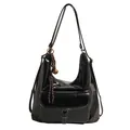 Glossy black faux leather tote bag with white stitching and decorative bell charm - Black