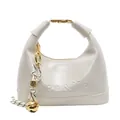 Creamy beige leather crescent handbag with gold handle buckle and bell charm - Off White