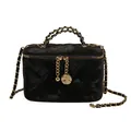 Quilted black vanity bag with gold chain strap and elegant rose charm pendant - Black